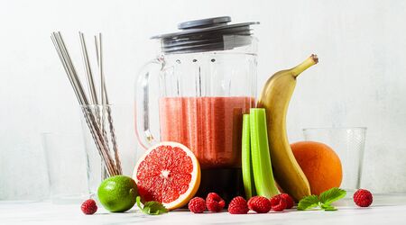 banner of smoothies in a glass blender bowl and ingredients on the table. Not disposable metal tubes. Healthly food.の写真素材