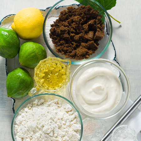 ingredients for sweet baked figs on a tray. flour, muscovado sugar, yogurt and lemonの写真素材