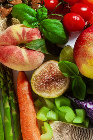basic vegan ingredients and products. cereals, legumes, fresh vegetables and fruits, oils, seeds and nuts. balanced healthy diet isolated on whiteの写真素材