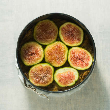 raw cake with figs in a baking dish, ready to be baked in the ovenの写真素材