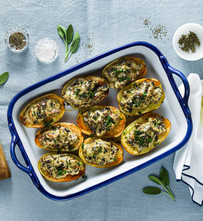 vegan baked potatoes with mushrooms in bechamel sauce with soy milk. healthy lunch or dinner for the familyの写真素材