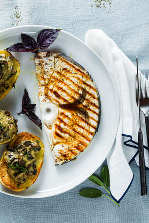 Serve with Baked Mushroom Potatoes and Swordfish Steak. healthy lunch or dinner for the familyの写真素材