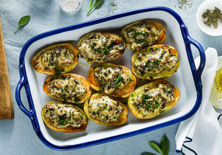 vegan baked potatoes with mushrooms in bechamel sauce with soy milk. healthy lunch or dinner for the familyの写真素材