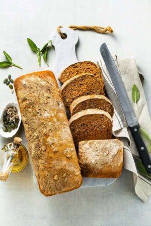 tomato bread with seeds and sun-dried tomatoes, a healthy morning breakfast or snackの写真素材