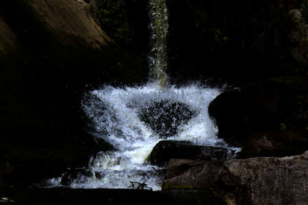 rushing streams of falling waterの写真素材