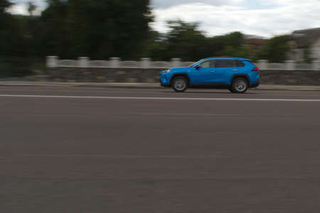 city traffic motion blurred passenger car in motionの写真素材