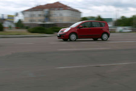 city traffic motion blurred passenger car in motionの写真素材