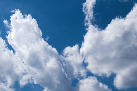 fluffy clouds on blue sunny sky