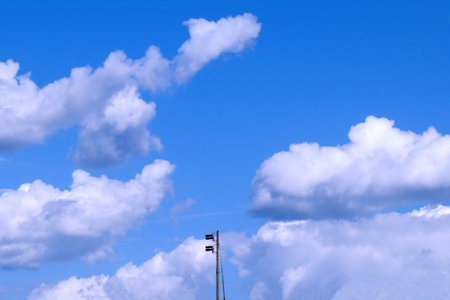 traffic light on a railroad pole on blue sky background
