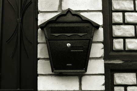mailbox on brick wall at the gate of houseの写真素材