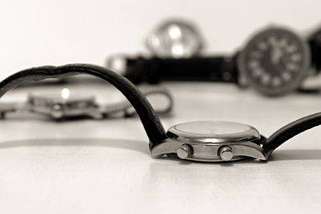 winding wheels of wrist watch close up on blurred background