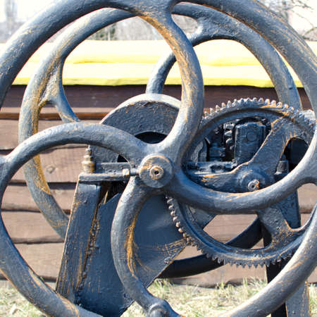 wheel of old gear mechanism close-up outdoorsの写真素材