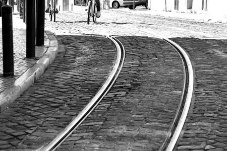 Tram rails on cobblestone street in old town. No peopleの写真素材