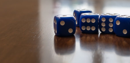 Cubes for dice close-up on blurred table backgroundの写真素材