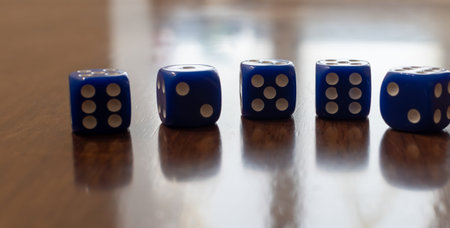Cubes for dice close-up on blurred table background