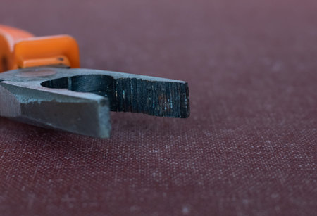 Pliers for cutting wire close-up on blurred background isolated
