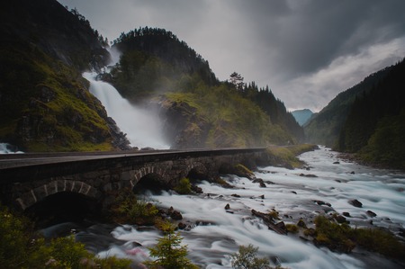 Falls in mountains of Norway in rainy weather.の写真素材
