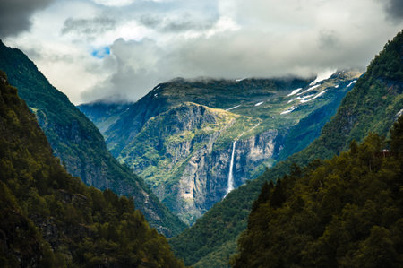 Falls in mountains of Norway in rainy weather.