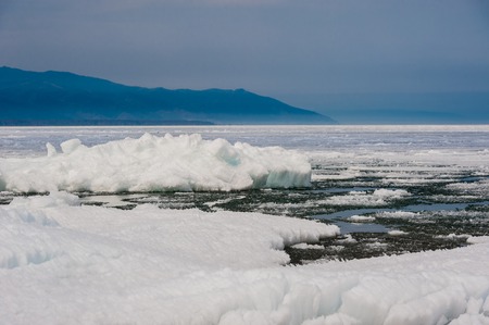 Day at Baikal Lake. Spring floating of ice .の写真素材