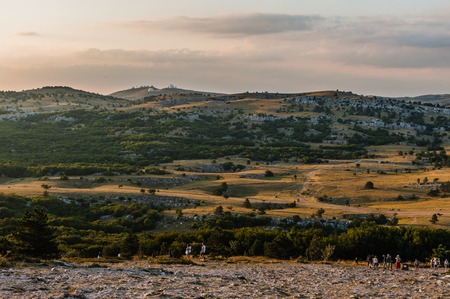 Rocks teeth above Yalta - celebrity Russia occupied Crimea. Ukrainians on the top of the cliff and cross Ukrainian climbers pulled the bridge for the development of extreme tourism.の写真素材