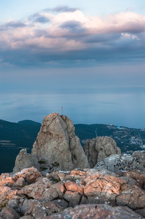 Rocks teeth above Yalta - celebrity Russia occupied Crimea. Ukrainians on the top of the cliff and cross Ukrainian climbers pulled the bridge for the development of extreme tourism.の写真素材