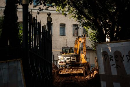 MOSCOW, RUSSIA - JUNE 16, 2019: excavator on the background of the houseのeditorial素材