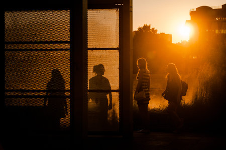 MOSCOW, RUSSIA - JUNE 25, 2016: Girls walking at sunset in the Museon Art Park.