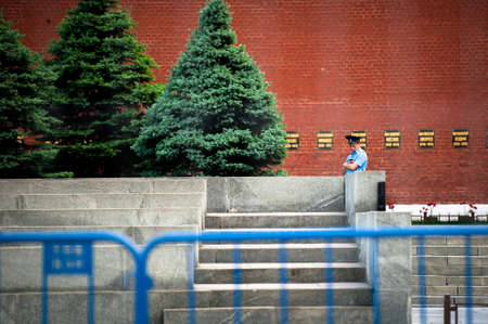 MOSCOW, RUSSIA - MAY 30, 2013: A policeman is standing on Red Square.のeditorial素材