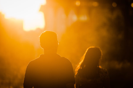 MOSCOW, RUSSIA - JUNE 25, 2016: Man and woman walking at sunset in the Museon Art Park.のeditorial素材