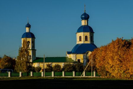 View of the Petropavlovskaya Church in the fall in Yasenevo at sunset.の写真素材