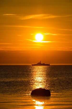 Wonderful landscape with a ship in the sea at sunset.の写真素材