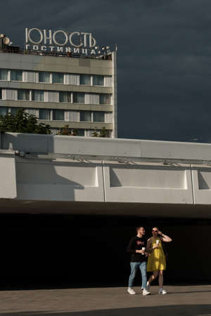 MOSCOW, RUSSIA - JULY 3 2021: A loving couple walks next to the Sportivnaya metro stationのeditorial素材