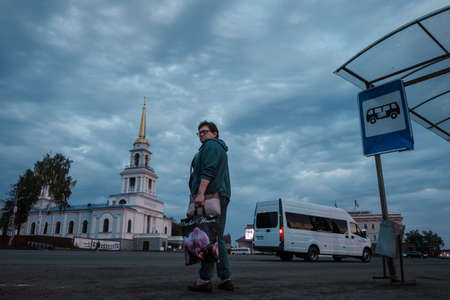 VOTKINSK, RUSSIA - AUGUST 26 2021: A woman stands at the Cathedral of the Annunciation of the Most Holy Theotokosのeditorial素材