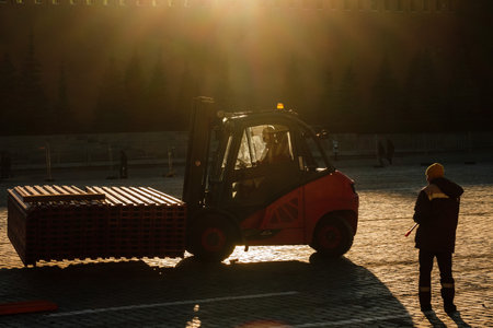MOSCOW, RUSSIA - MARCH 15 2022: A forklift and a man in Red Squareのeditorial素材