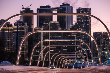 Evening view of the bridge and residential buildings on Mosfilmovskaya Street in Moscow