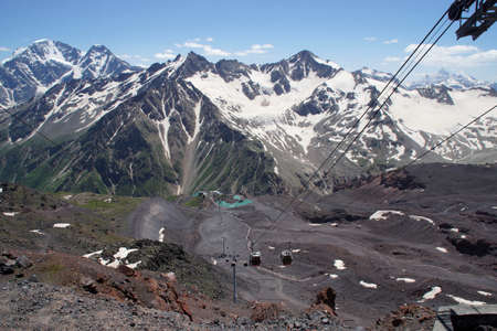 Beautiful snow-capped mountain peaks of the Caucasus Mountains next to the highest peak in Europe - Elbrusの写真素材