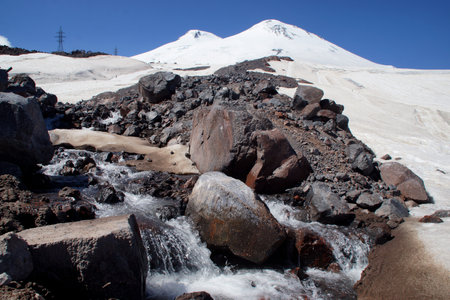 Beautiful snow-capped mountain peaks of the Caucasus Mountains next to the highest peak in Europe - Elbrusの写真素材