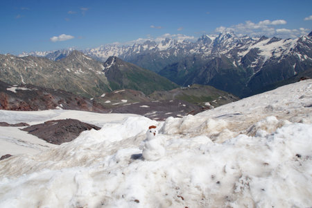 Beautiful snow-capped mountain peaks of the Caucasus Mountains next to the highest peak in Europe - Elbrusの写真素材