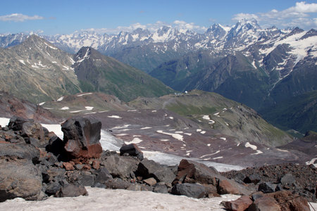 Beautiful snow-capped mountain peaks of the Caucasus Mountains next to the highest peak in Europe - Elbrusの写真素材