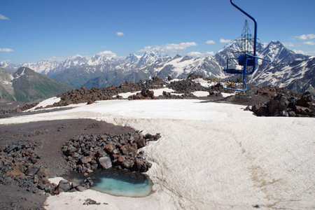 Beautiful snow-capped mountain peaks of the Caucasus Mountains next to the highest peak in Europe - Elbrusの写真素材