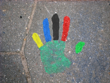 Handprint on a tile  Fingerprints are painted in the colors of the sports competition rings  blue, black, red, yellow, greenのeditorial素材