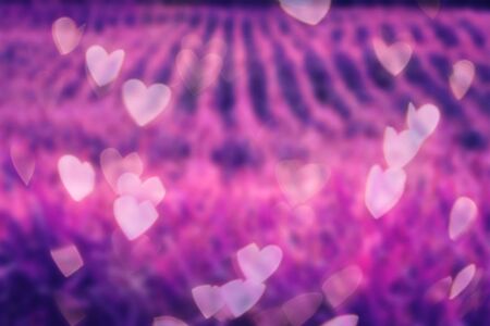 Colorful vibrant background wallpaper with bokeh hearts art design.の写真素材