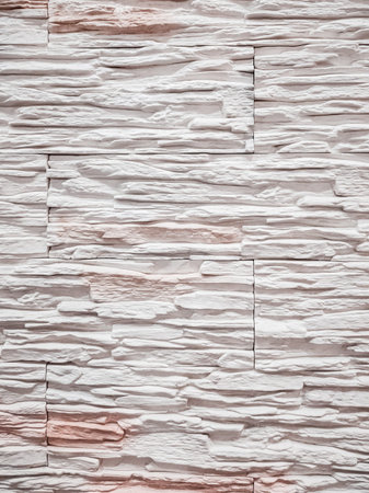 Beautiful embossed texture of wall finishing gray tiles.