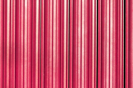 Texture of metal corrugated iron sheet. Crimson horizontal background.の写真素材