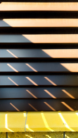 Decorative brown background with striped parallel lines and sunbeams. vertical frame.の写真素材