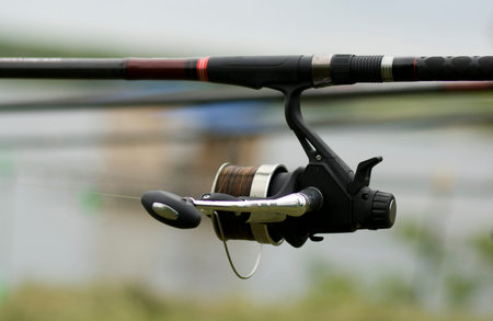 Fishing reel near the shore waiting for a big fish.