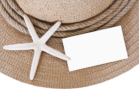 Straw hat and starfish and blank isolated on white backgroundの写真素材