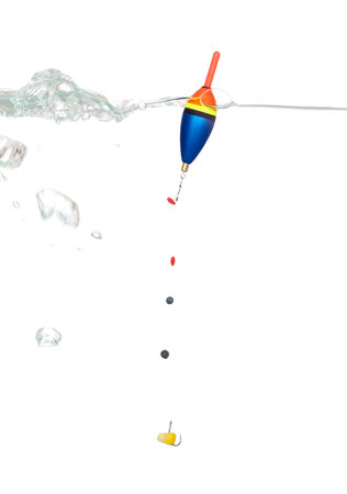 Bobber and corn on the hook as bait in the water