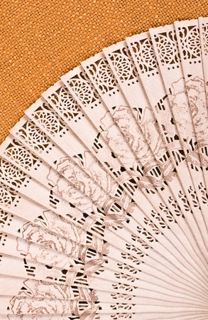 Open wood folding fan on sackingの写真素材