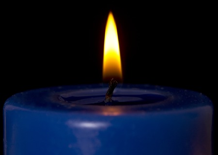 Macro shot of a single candle flame.の写真素材